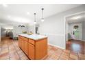 Open concept kitchen with eat-in island and terra cotta tile flooring at 2240 Murdock Rd, Marietta, GA 30062