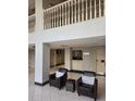Lobby seating area with dark leather chairs facing the concierge reception desk at 2479 Peachtree Ne Rd # 902, Atlanta, GA 30305