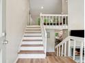 Bright entryway featuring a staircase and wood flooring at 1720 Little Willeo Rd, Marietta, GA 30068