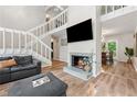 Living room with a fireplace, stairs, and view of the dining room at 1720 Little Willeo Rd, Marietta, GA 30068