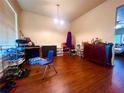 Spacious living room featuring hardwood floors, bright windows, and a modern ceiling fan at 1560 Park Grove Dr, Lawrenceville, GA 30046