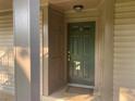 View of the unit's front door featuring a traditional design, secure entry, and neutral color scheme at 3117 Colonial Way # G, Atlanta, GA 30341