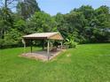 Outdoor pavilion with chairs offers a great space to relax and enjoy nature at 2323 Cedar Terrace Rd, Lithia Springs, GA 30122