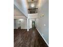 Open foyer with soaring ceilings, hardwood floors and modern light fixtures at 944 Reap Ln, Lawrenceville, GA 30043