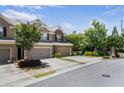 Brick townhouse with well maintained landscaping, two car garage and driveway at 11686 Davenport Ln, Alpharetta, GA 30005