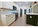 Contemporary kitchen with stainless steel appliances, center island and stylish cabinetry at 455 Saddle Bow Dr, Lawrenceville, GA 30046