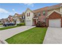 Charming multi-Gathering townhomes featuring garages, and manicured lawns adding to the community's curb appeal at 2924 Greyhawk Ln, Cumming, GA 30040
