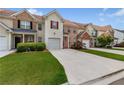 Charming multi-Gathering townhomes featuring garages, and manicured lawns adding to the community's curb appeal at 2924 Greyhawk Ln, Cumming, GA 30040