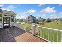 Enjoy scenic views from this spacious wooden deck, perfect for entertaining or relaxing outdoors at 92 River Walk Pkwy, Euharlee, GA 30145