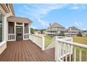 Spacious deck with a screened in section and views of the backyard and neighboring properties at 92 River Walk Pkwy, Euharlee, GA 30145