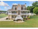 Beautiful home with a well-manicured lawn and inviting porch, perfect for outdoor living and relaxation at 92 River Walk Pkwy, Euharlee, GA 30145