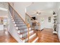 Elegant staircase with wooden treads and decorative iron railings, leading to the living area at 92 River Walk Pkwy, Euharlee, GA 30145