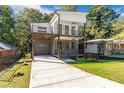 Charming modern two-story home with a large garage, covered porch, balcony, and lush green front lawn at 1464 Ezra Church Nw Dr, Atlanta, GA 30314