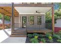 Inviting covered front porch with elegant railing and a view of the yard at 1464 Ezra Church Nw Dr, Atlanta, GA 30314