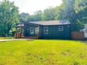 View of cozy home, showcasing its well-maintained lawn and simple yet pleasing landscaping at 2228 Carey Se Dr, Atlanta, GA 30315