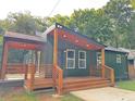 The house has a comfortable covered porch, creating a welcoming atmosphere at 2228 Carey Se Dr, Atlanta, GA 30315
