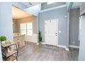 Bright foyer with high ceilings, wood-look floors, and neutral paint, creating an open entrance at 4560 Buckskin Way, Douglasville, GA 30135