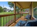 Inviting front porch with comfortable seating and a view of the landscaped yard at 35 Lady Morgan Ln, Dallas, GA 30157