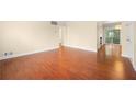 Spacious living room with hardwood floors leading to dining area and a view of the backyard; ideal for Gathering gatherings at 2355 Henderson Mill Ne Rd # 6, Atlanta, GA 30345