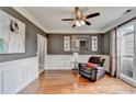 Cozy living room with chair, hardwood flooring, and natural light from a large window at 708 Edgeley Ln, Lawrenceville, GA 30044