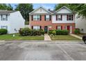 A townhome with well-kept lawn and landscaping, complemented by brick and siding accents at 1955 Shawn Wayne Se Cir, Atlanta, GA 30316
