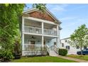 Stylish two-story house with double porch, appealing architecture, and well-maintained landscaping at 315 Melrose Ave, Decatur, GA 30030