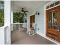 Inviting front porch with rocking chairs, ceiling fan, and classic wooden door at 315 Melrose Ave, Decatur, GA 30030