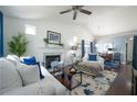 Bright living room boasts vaulted ceilings, fireplace, and seamless flow to the dining area at 2305 Keenland Ct, Cumming, GA 30040