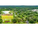 Aerial perspective, highlighting the home's expansive, tree-lined surroundings in a suburban community at 2696 Eldorado Pl, Snellville, GA 30078