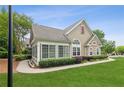 Well-maintained home with a green lawn, detailed trim, and stone accents at 6107 Malloway Ct # B-6107, Cumming, GA 30041