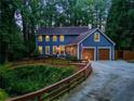 Beautiful two-story home with a charming exterior, featuring an attached two-car garage and inviting curb appeal at 7250 Hunters Branch Dr, Atlanta, GA 30328