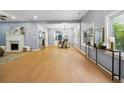 Spacious living room featuring hardwood floors, a fireplace, and plenty of natural light at 1382 Elizabeth Ln, Atlanta, GA 30344