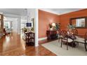 Elegant dining room with hardwood floors, decorative rug, and stylish furnishings for a great ambiance at 1771 Silvergrass Ln, Grayson, GA 30017