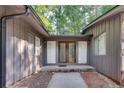 Home exterior featuring a wooden and glass front door with sidelight windows at 235 Trailmore Ct, Roswell, GA 30076