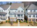 Charming two-story home with brick accents and a cozy front porch, nestled in a well-manicured neighborhood at 164 Inwood Walk, Woodstock, GA 30188