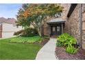 Inviting entrance with well-maintained landscaping and a walkway leading to the front door at 1800 Hunters Moon Dr, Alpharetta, GA 30005