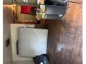Interior room with a mattress, damaged walls, and discarded items showcasing the room's state at 1934 Apache Se Trl, Atlanta, GA 30316