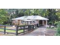Charming brick home with a metal roof and welcoming front gazebo at 2225 Harold Se Ln, Smyrna, GA 30080