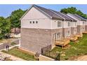 Townhouse backyard showcasing a wood deck and newly installed lawn at 235 W Marietta St, Canton, GA 30114