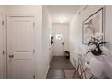 Inviting hallway with modern decor, stylish lighting, and wood-look floors at 4175 Spring Valley Cir, Tucker, GA 30084