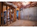 Unfinished basement space with exposed framing and concrete walls at 7071 Glen Cove Ln, Stone Mountain, GA 30087