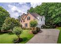 Beautiful home with a well-maintained lawn and mature trees at 7071 Glen Cove Ln, Stone Mountain, GA 30087