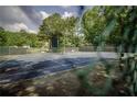 Community tennis courts surrounded by lush greenery at 7071 Glen Cove Ln, Stone Mountain, GA 30087