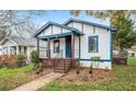 Inviting home with landscaped yard and charming front porch at 819 Humphries St, Atlanta, GA 30310