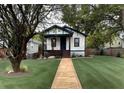 Well-maintained home with lush lawn and inviting front porch at 819 Humphries St, Atlanta, GA 30310