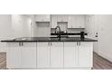 Modern kitchen island with sleek black countertop and ample storage space at 819 Humphries St, Atlanta, GA 30310