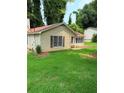 This single-story home has vinyl siding, a cozy yard, and lots of potential at 6103 Chaseland Dr, Rex, GA 30273