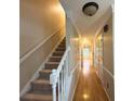 Inviting hallway with hardwood floors and staircase leading to the upper level, bathed in natural light at 2872 Bentwood Dr, Marietta, GA 30062