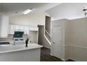 Open kitchen with white cabinetry, modern appliances, and a breakfast bar perfect for casual dining at 2915 Camelot Woods Dr, Lawrenceville, GA 30044