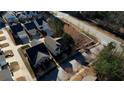 An aerial shot displays the home, surrounding streets, nearby houses, and the general layout of the neighborhood at 5114 Arnold St, Covington, GA 30014